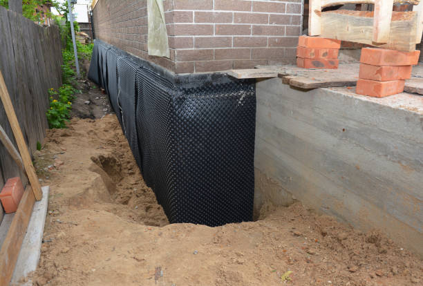 SJ Waterproofing Pros technician performing targeted Foundation Crack Repair assessment in Burgoon, OH